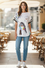 Load image into Gallery viewer, Petit Pois by Viviana G white nylon mesh dolman sleeve top with abstract face print and striped cuffs.
